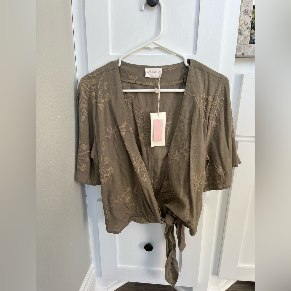 NWT boutique brand wrap top. Size small.